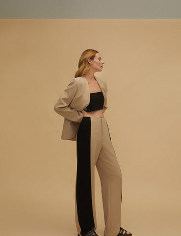 Interspersed with contrast color collarless suits